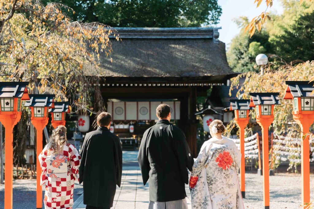 Bride, groom, and close family standing together during an intimate autumn wedding in Kyoto
