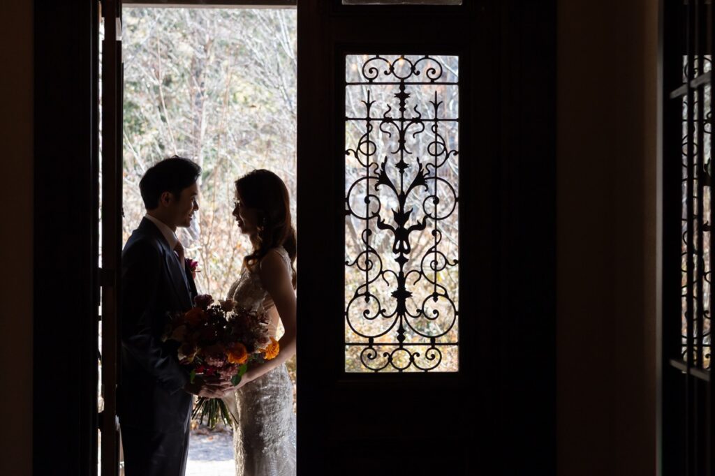 Backlit portrait of bride and groom during a destination wedding in Japan